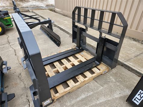 removable skid plate under skid steer|pallet forks skid steer mount.